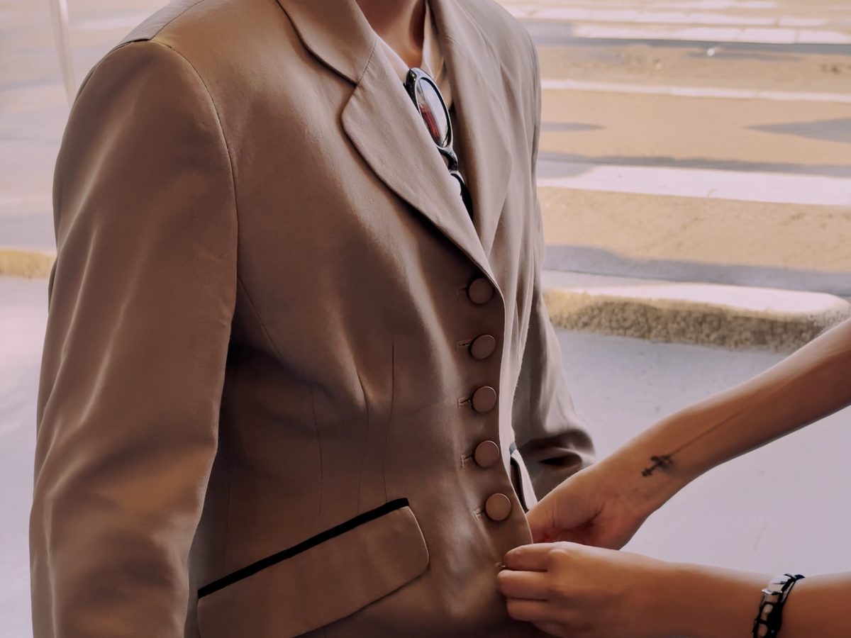 Fitting a vintage tailored jacket during a private tour